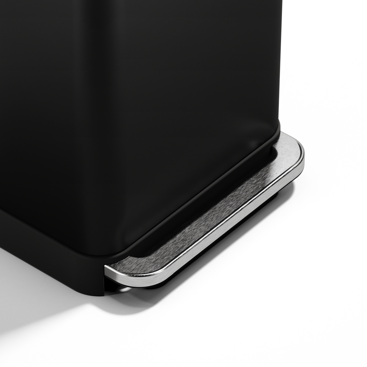 Detail view showing the robust Brushed Stainless Steel pedal of the Simplehuman Matte Black Step Can.