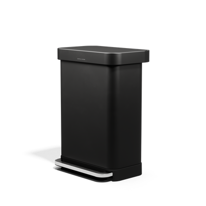 Angled view of Simplehuman 55L Rectangular Step Can in Matte Black with hands-free foot pedal and liner pocket.