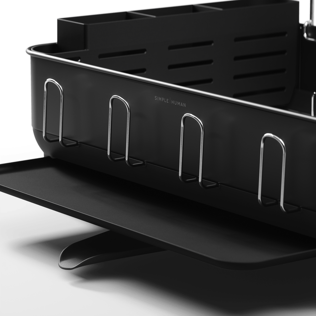 Detail view of Simplehuman Matte Black Steel Frame Dishrack showing integrated cup hooks and pivoting drain spout.