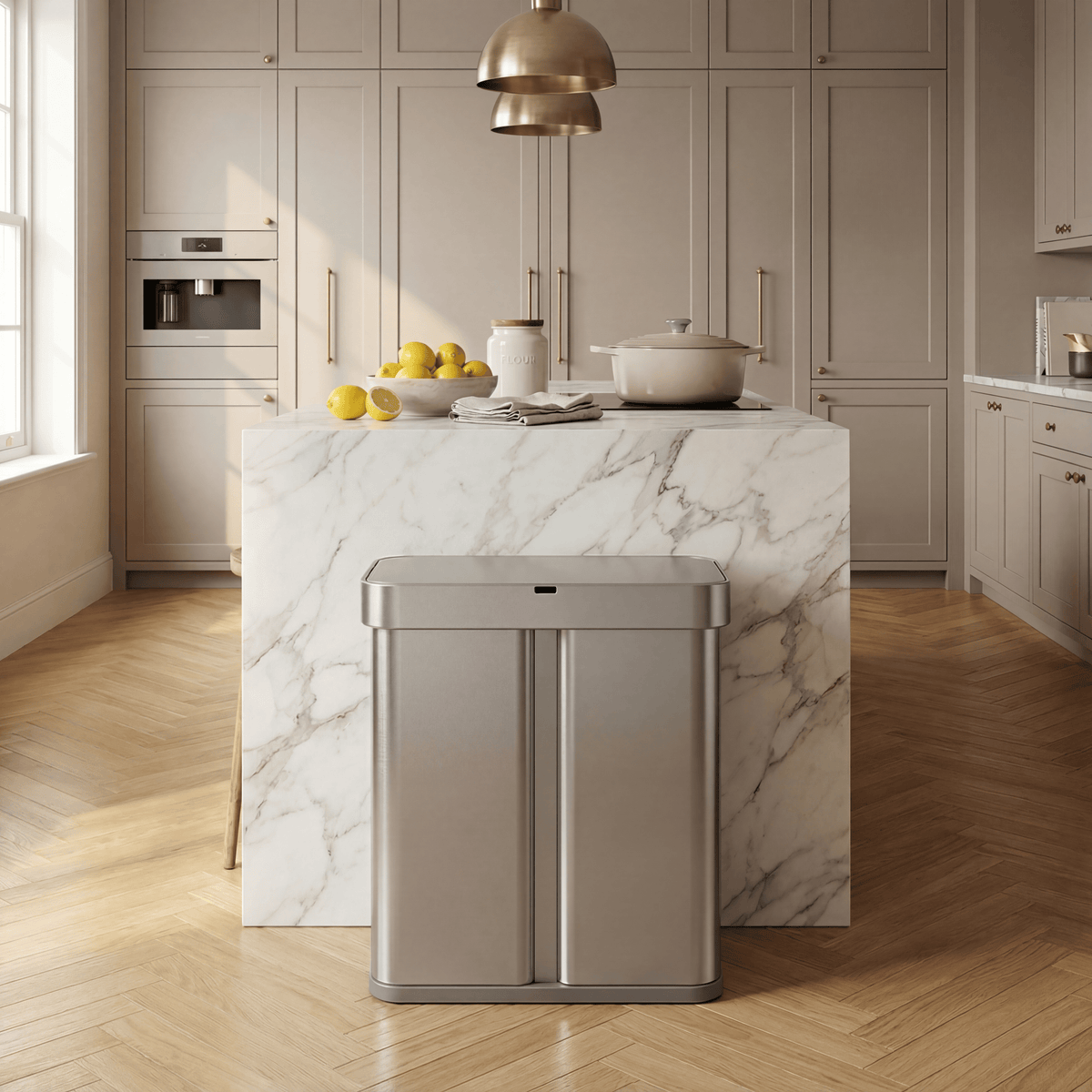 Simplehuman's 58L Sensor Can in Brushed in a modern household with beige and marble countertop and appliances as well as kitchen appliances and produce on the counter top with the main focus being on the sensor can.