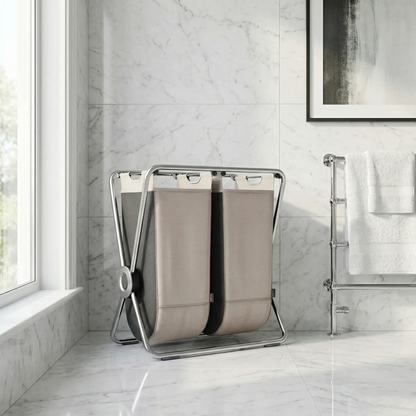 Simplehuman's Double X-Frame Hamper in a bathroom with marble tiles.