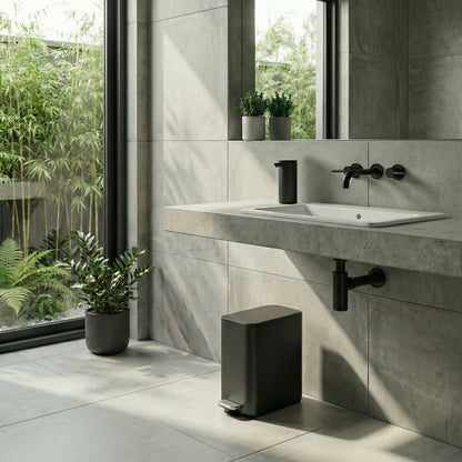 Simplehuman's 5L Slim Step Can in a modern bathroom environment with neutral tiles on the walls and floors including greenery in the background.