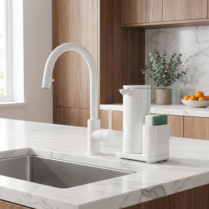 Simplehuman's 14 oz. Liquid Sensor Pump with Caddy in White in a modern kitchens setting with marble countertops, wooden cabinets, small plants and produce on the countertop.
